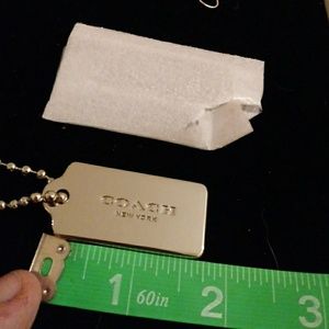 Coach silver hang tag Metal